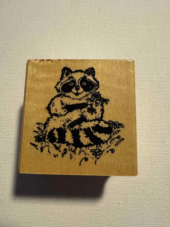 none - 1.75X1.75" Racoon with flowers Wood Mounted Rubber Stamp; By Embossing Arts