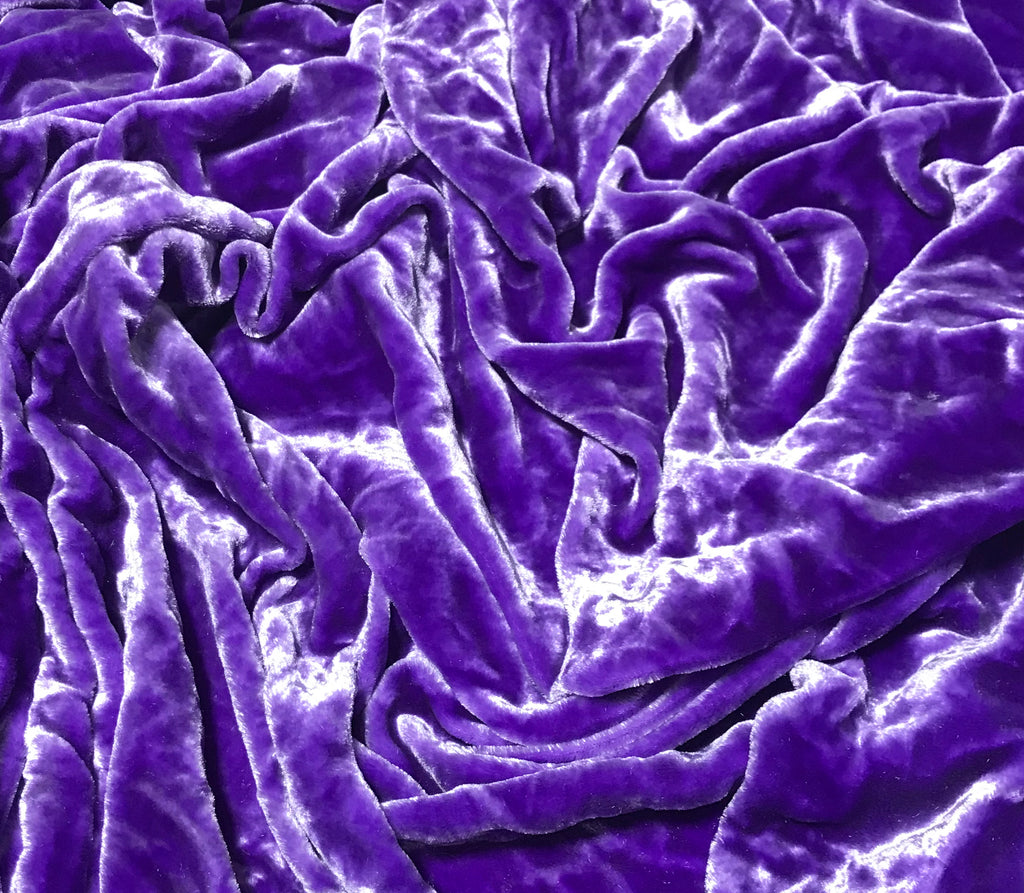 Vivid purple fabric with close up of texture